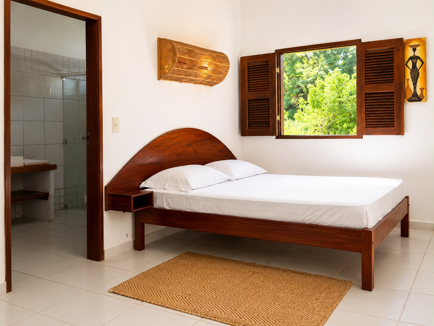 Suite bedroom with wooden headboard and garden window